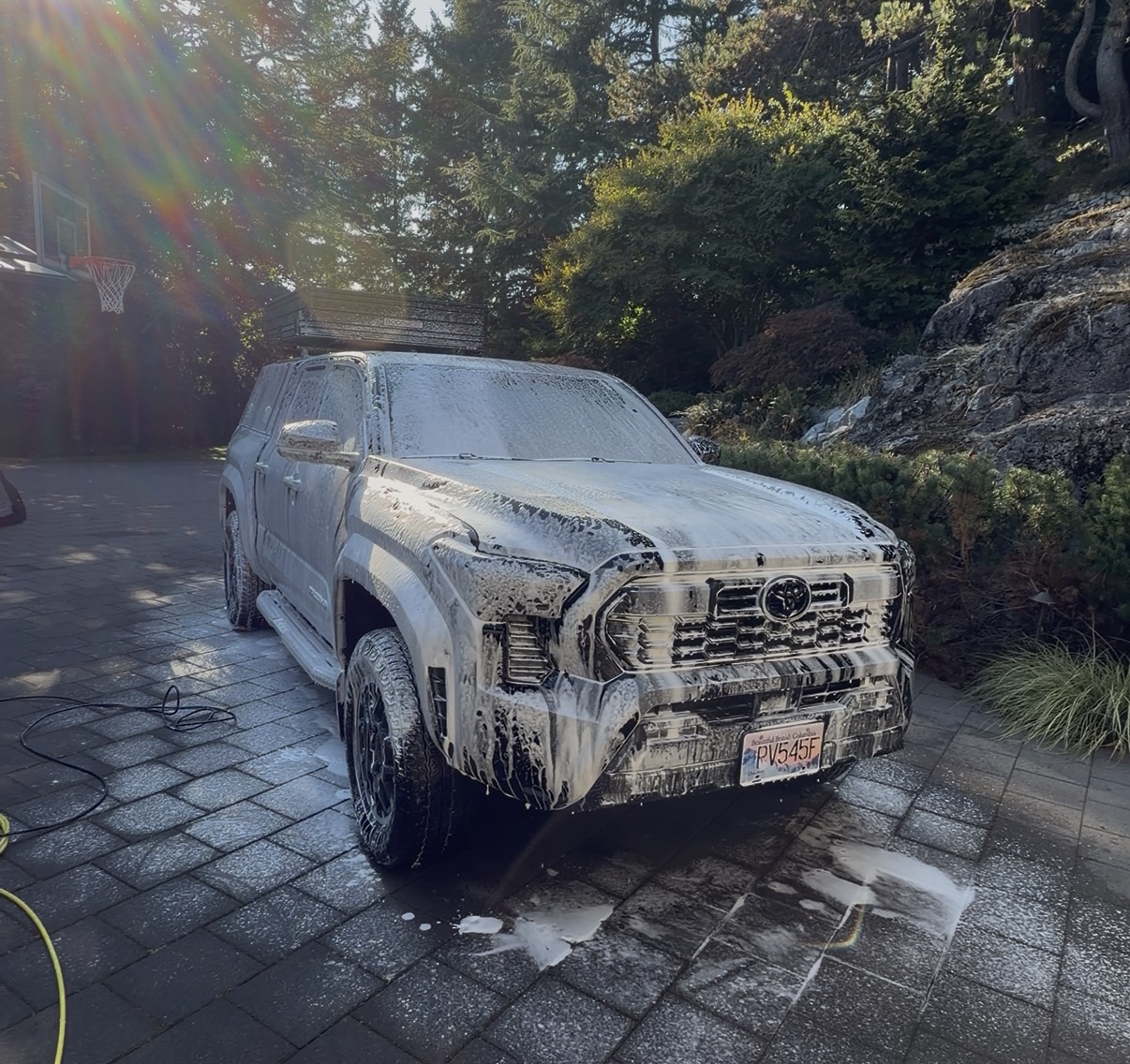 Truck covered in thick soap foam during a Radiant Detail mobile wash